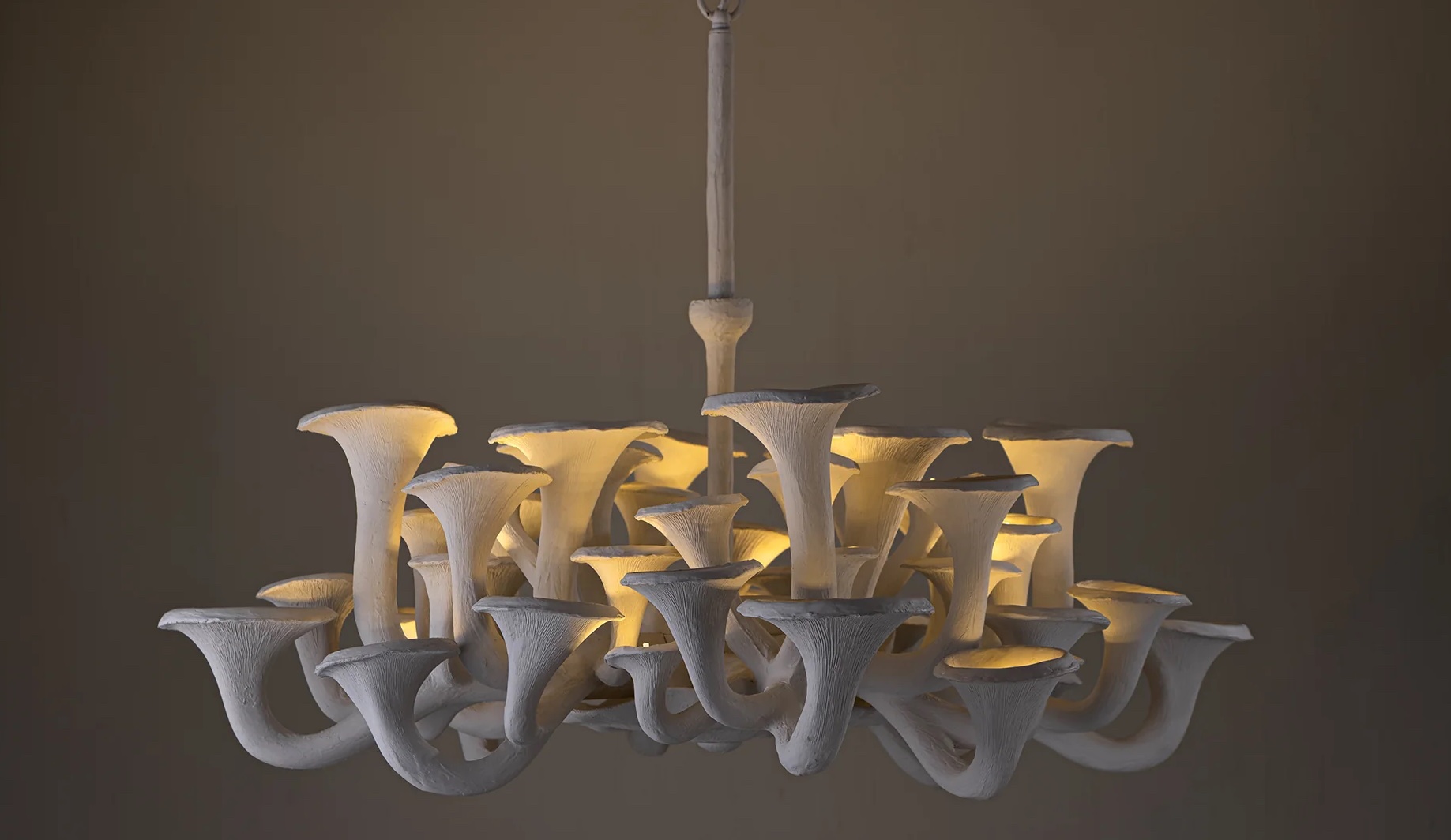 The Porta Romana Mushroom chandelier in sustainable composite, layered with plaster