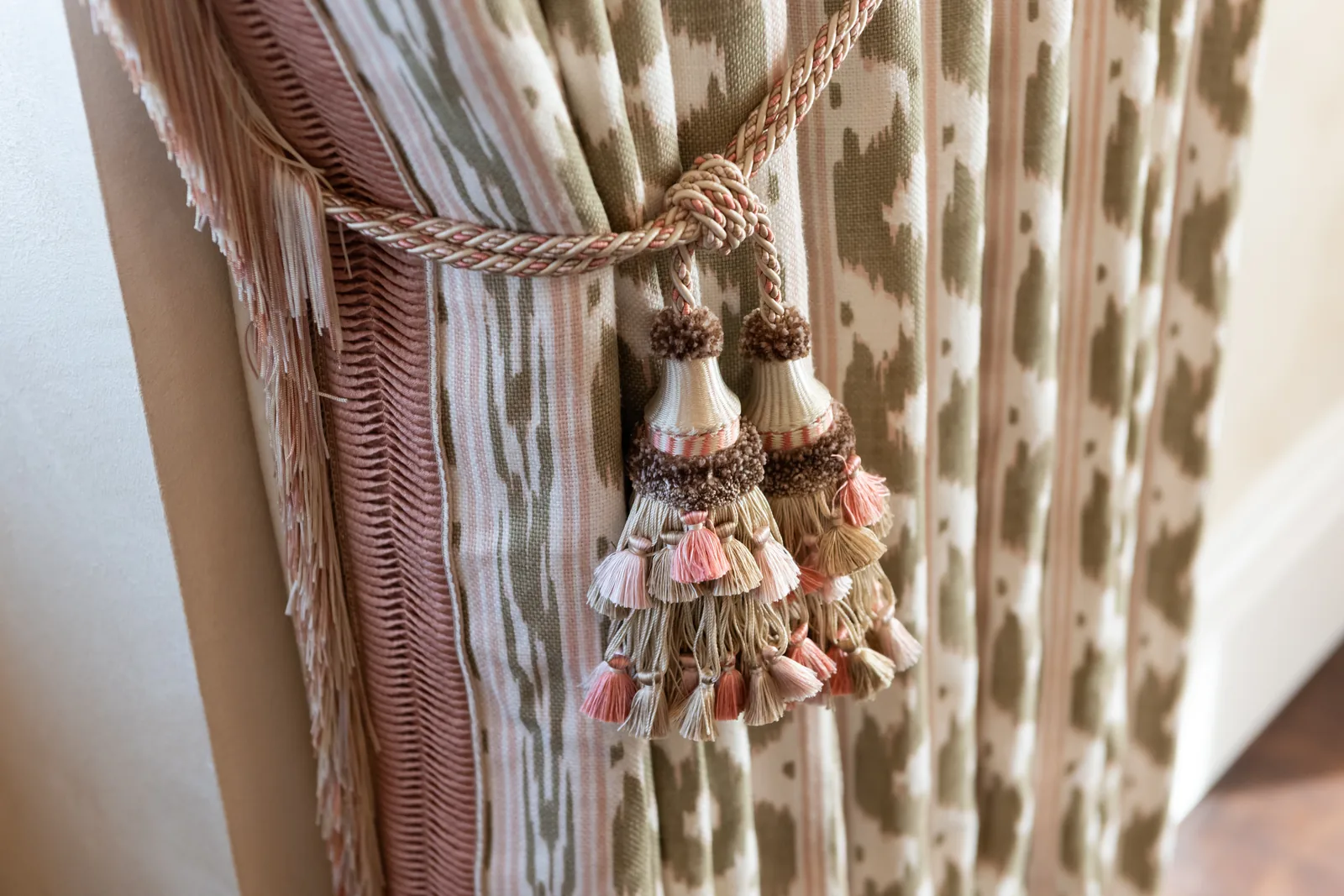 Thorp of London patterned curtain fabric with pink and ivory tassel tiebacks